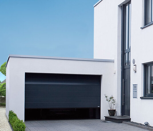 Sectional garage door in steel blue